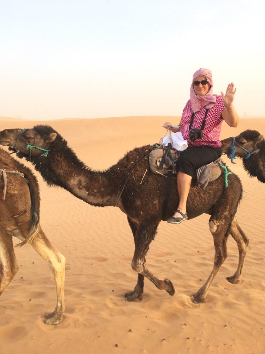 Jane Cooley rides a camel during a 3D Journey's trip to Morocco.